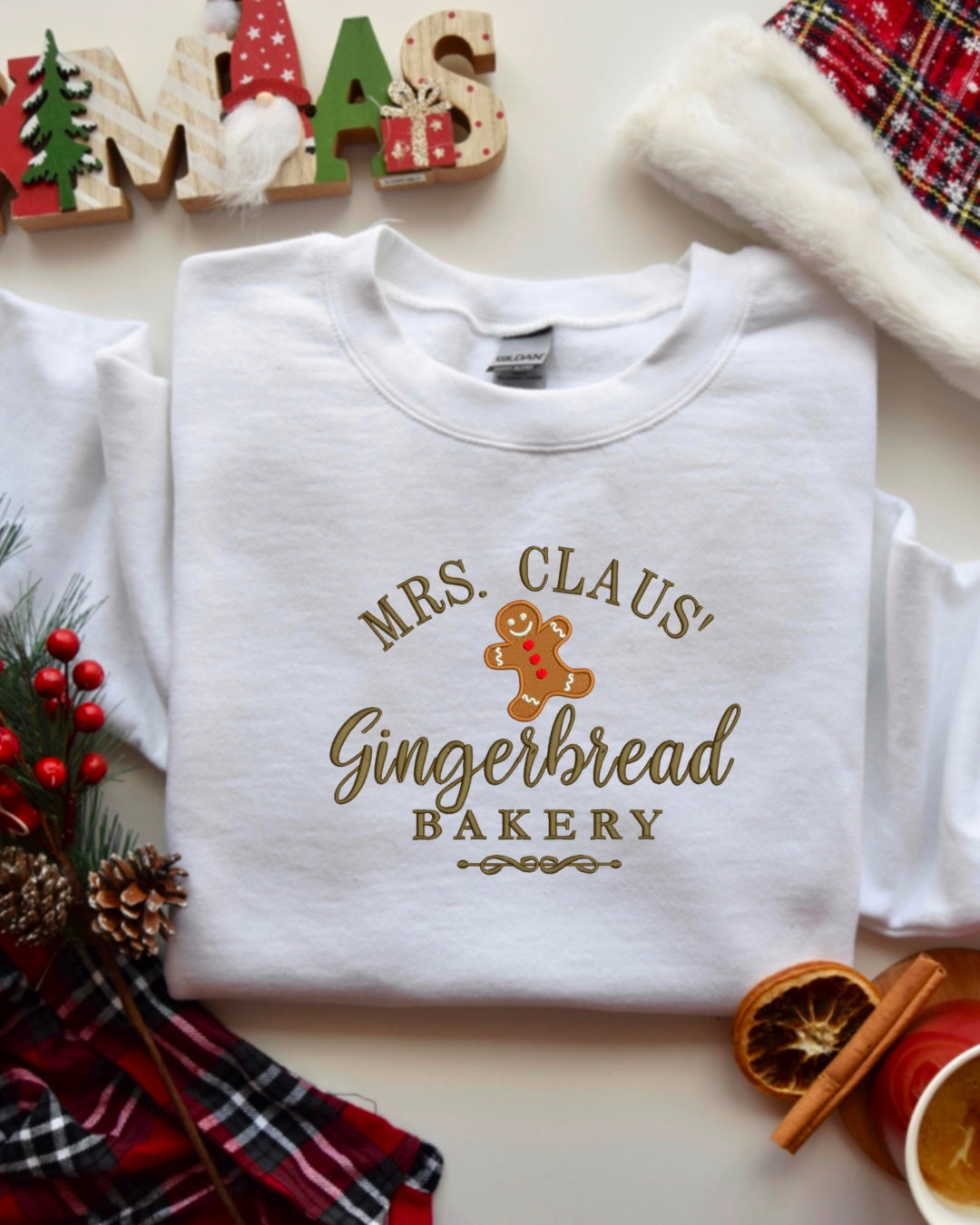 Mrs. Claus’ Gingerbread Bakery Embroidered Crewneck